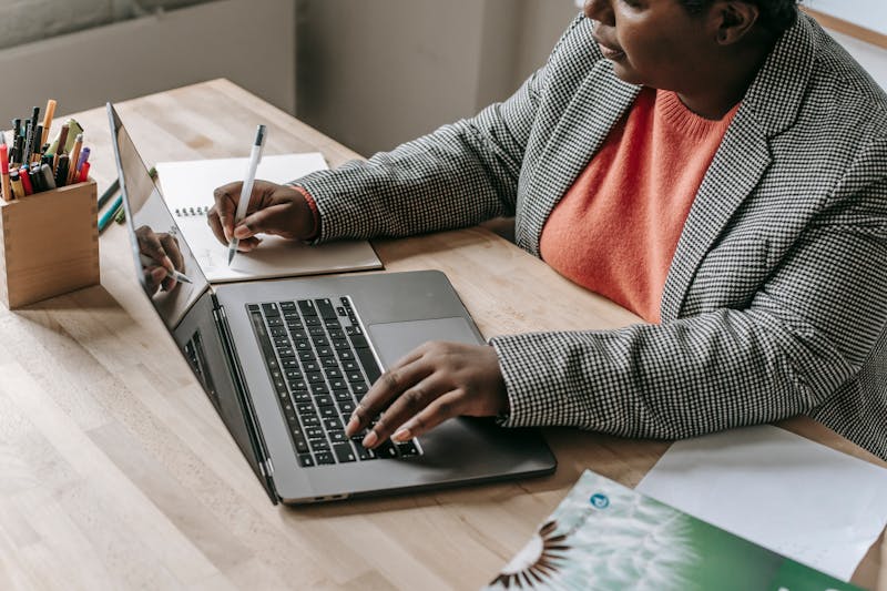 African professional reviewing technical documents